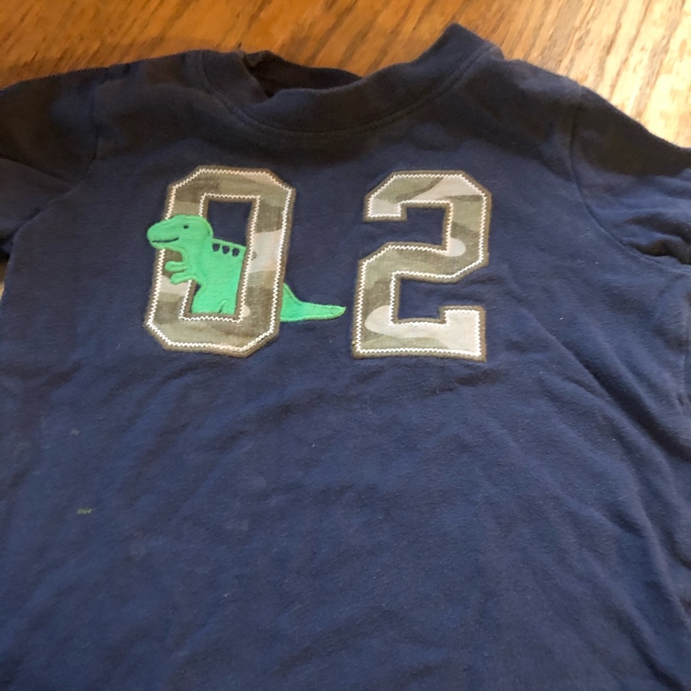 T shirt with 02 and a dinosaur